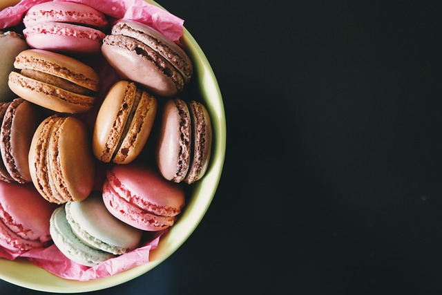 pink and brown macarons arranged in a bowl